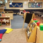 The age 3 classroom has a play area, desks and more for your kids.
